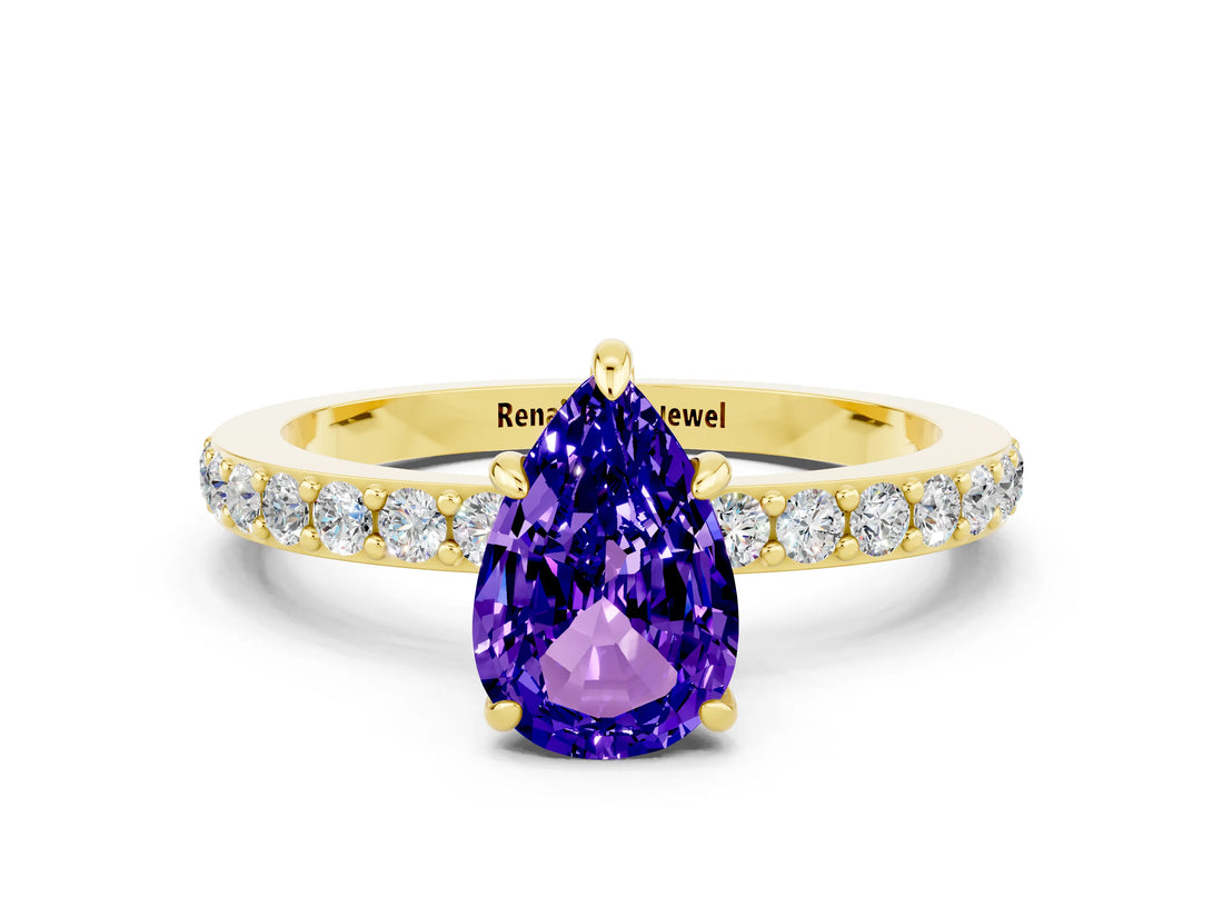 Yellow gold Pear Cut Tanzanite Solitaire Engagement Ring with Pavé Band and Four-Prong Setting