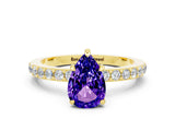 Yellow gold Pear Cut Tanzanite Solitaire Engagement Ring with Pavé Band and Four-Prong Setting