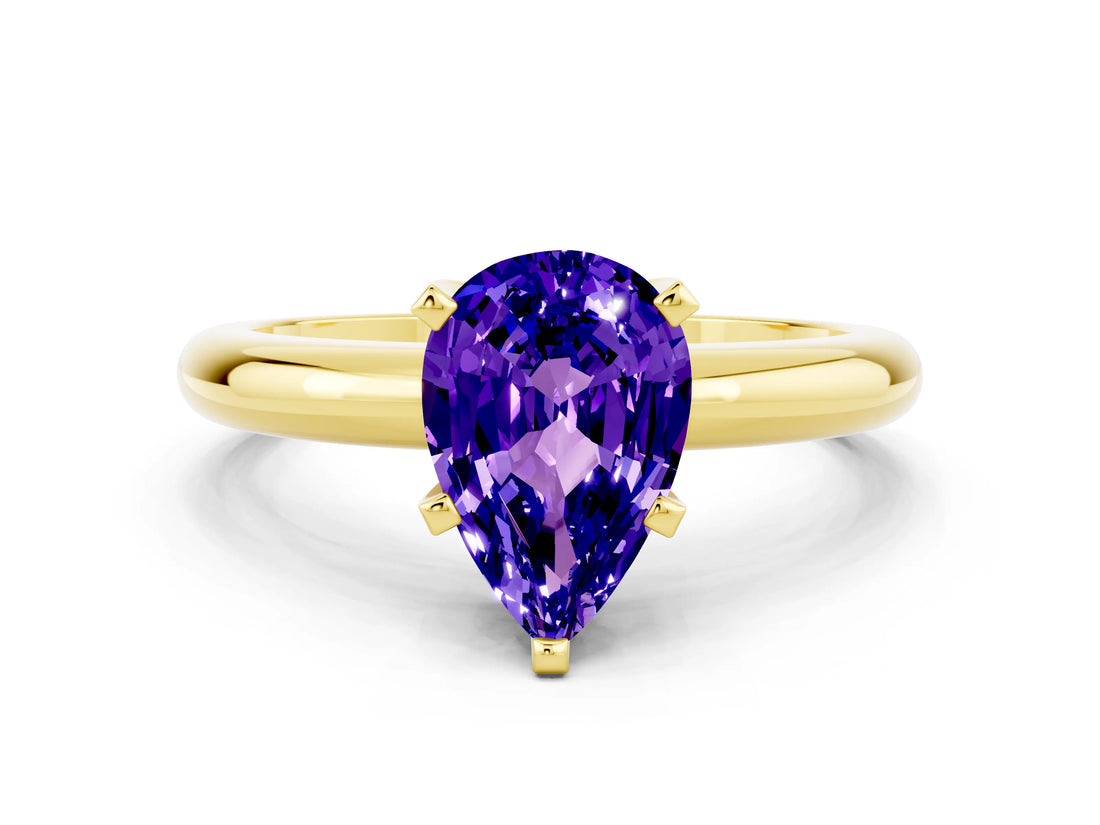 Yellow gold Pear Cut Tanzanite Solitaire Engagement Ring with Round Band and Four-Prong Setting