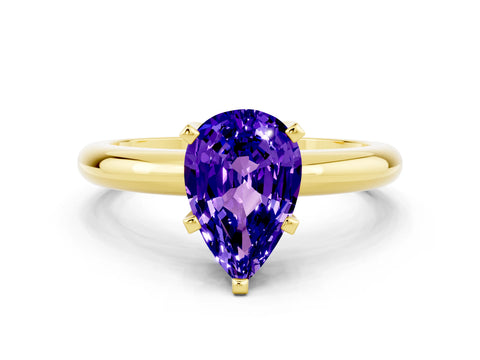 Yellow gold Pear Cut Tanzanite Solitaire Engagement Ring with Round Band and Four-Prong Setting