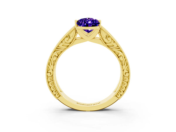 Yellow gold Pear Cut Tanzanite Solitaire Ring with Engraved Band and Four-Prong Setting