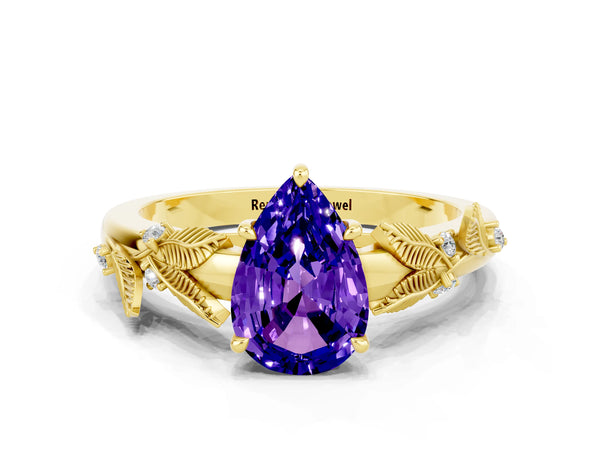 Yellow gold Pear Cut Tanzanite Solitaire Ring with Leaf Motif Band and Four-Prong Setting