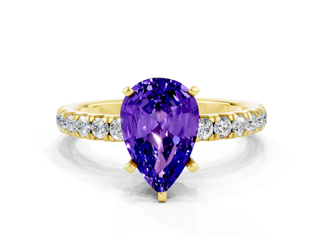 Yellow gold Pear Cut Tanzanite Solitaire Ring with Pavé Accents and Four-Prong Setting