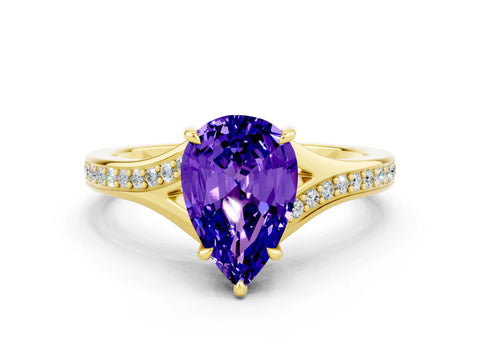Yellow gold Pear Cut Tanzanite Solitaire Ring with Pavé Band and Prong Setting