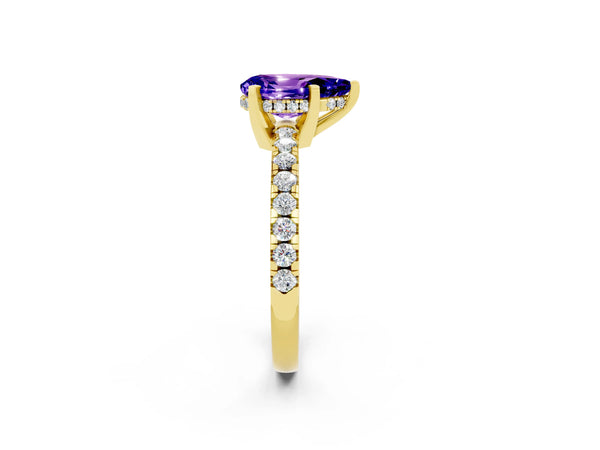 Yellow gold Pear Cut Tanzanite Solitaire Ring with Round Pavé Band and Four-Prong Setting