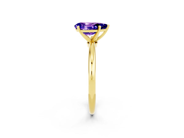 Yellow gold Pear Cut Tanzanite Solitaire Ring with Six-Prong Setting and Classic Band