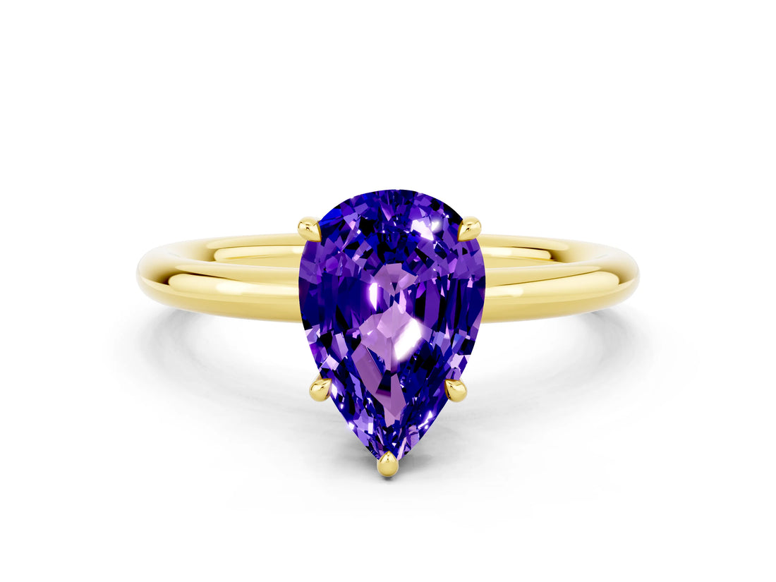 Yellow gold Pear Cut Tanzanite Solitaire Ring with Thin Band and Four-Prong Setting