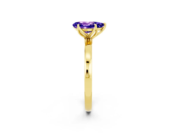Yellow gold Pear Cut Tanzanite Solitaire Ring with Thin Band and Prong Setting