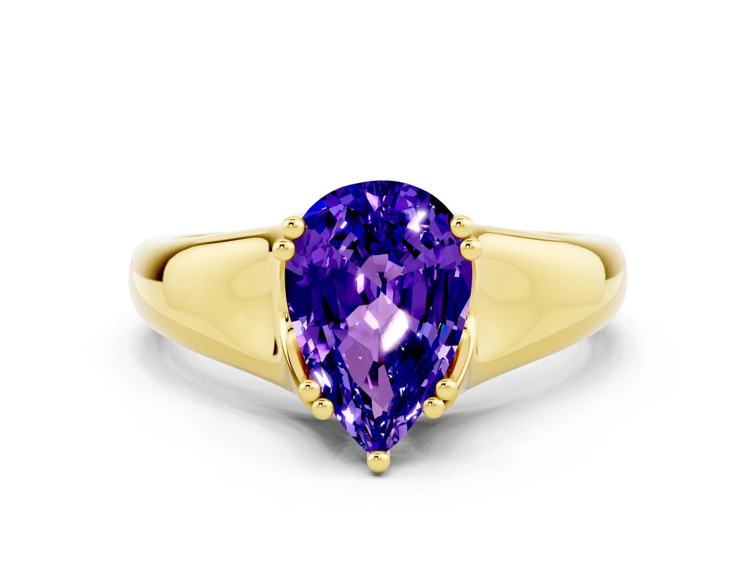 Yellow gold Pear Cut Tanzanite Solitaire Ring with Wide Band and Prong Setting