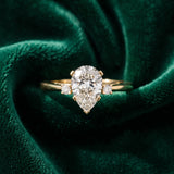 Yellow gold Pear Cut Three-Stone Solitaire Ring with Round Accent Diamonds and Four-Prong Setting_52
