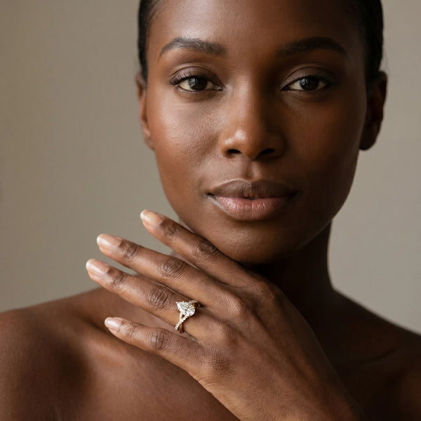 Yellow gold Pear Cut Twist Band Solitaire Diamond Ring with Pavé Setting