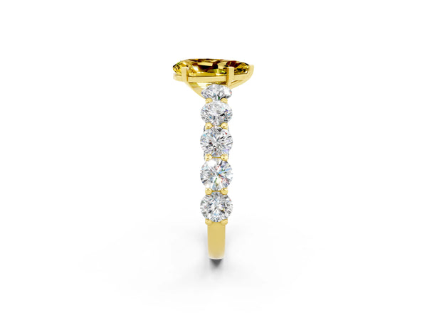 Yellow gold Pear Cut Yellow Sapphire Prong Setting with Side Stones on a Pave Band
