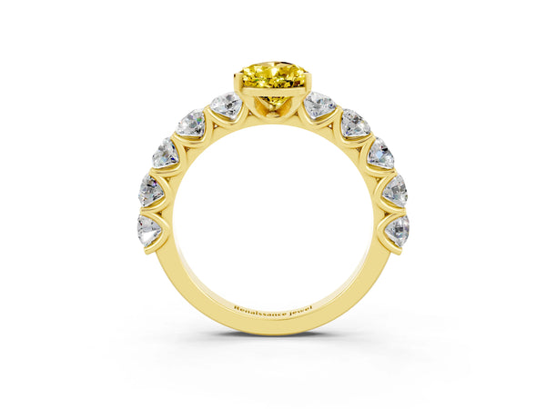 Yellow gold Pear Cut Yellow Sapphire Prong Setting with Side Stones on a Pave Band
