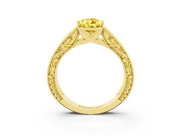 Yellow gold Pear Cut Yellow Sapphire Solitaire Ring with Engraved Band and Four-Prong Setting