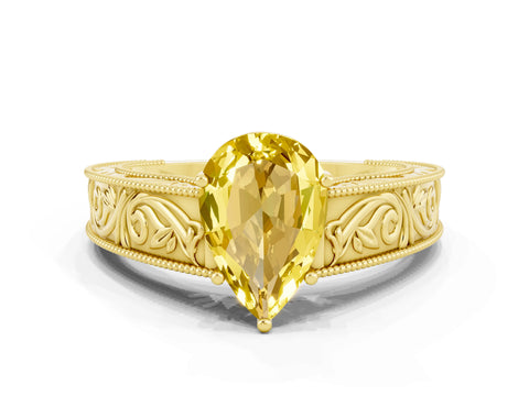Yellow gold Pear Cut Yellow Sapphire Solitaire Ring with Engraved Band and Four-Prong Setting