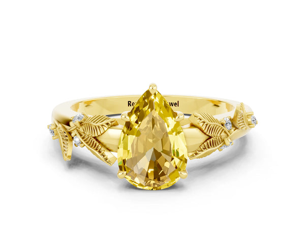Yellow gold Pear Cut Yellow Sapphire Solitaire Ring with Leaf Motif Band and Four-Prong Setting