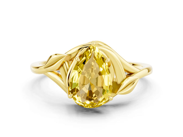 Yellow gold Pear Cut Yellow Sapphire Solitaire Ring with Twist Band and Four-Prong Setting