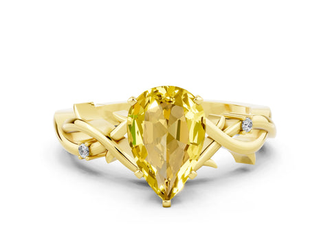 Yellow gold Pear Cut Yellow Sapphire Solitaire Ring with Twisted Band and Prong Setting