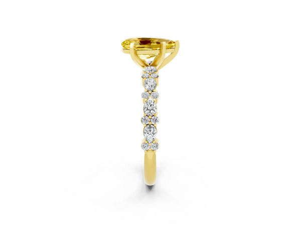 Yellow gold Pear Cut Yellow Sapphire Side Stone Solitaire Ring with Round  and Four-Prong Setting