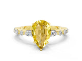 Yellow gold Pear Cut Yellow Sapphire Solitaire with Side Stones on a Pavé Band and Four-Prong Setting_24