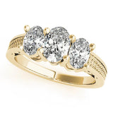 Yellow gold Pear Diamond Three-Stone Ring with Prong Setting and Textured Band 1