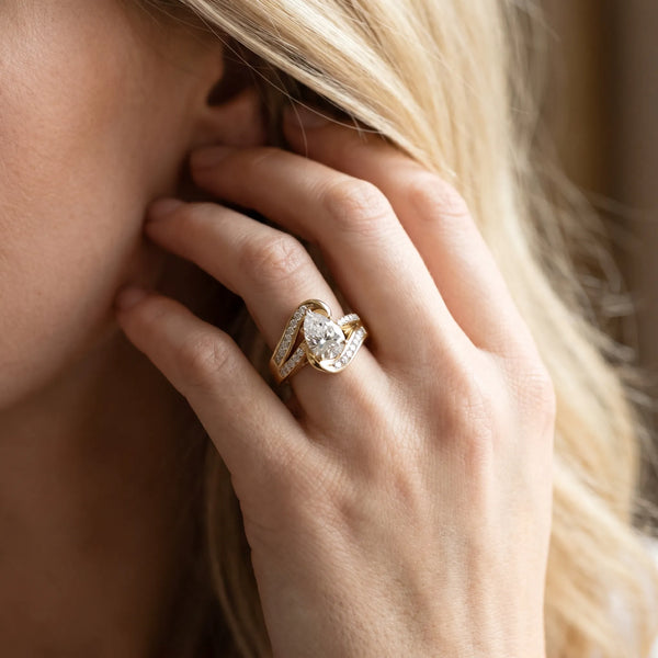 Yellow gold Pear Solitaire Bypass Diamond Engagement Ring with Channel-Set Band and Four-Prong Setting