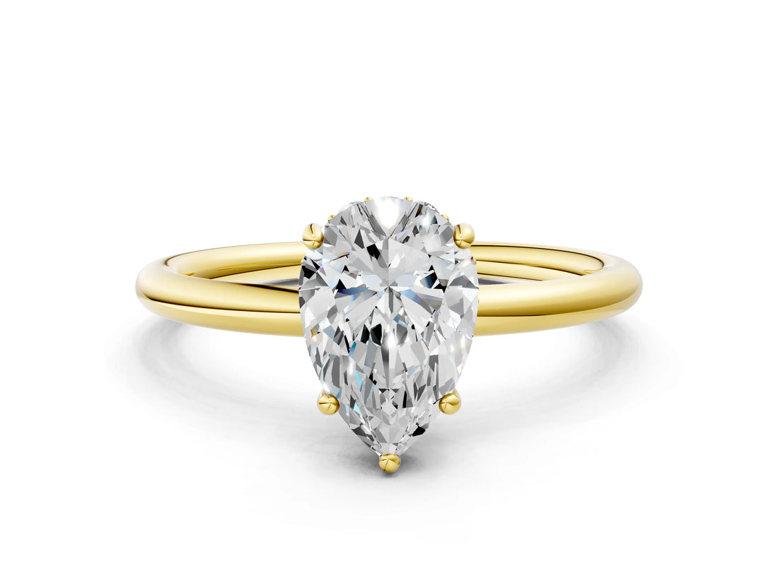 Yellow gold Pear Solitaire Diamond Ring with a Classic Band and Four-Prong Setting