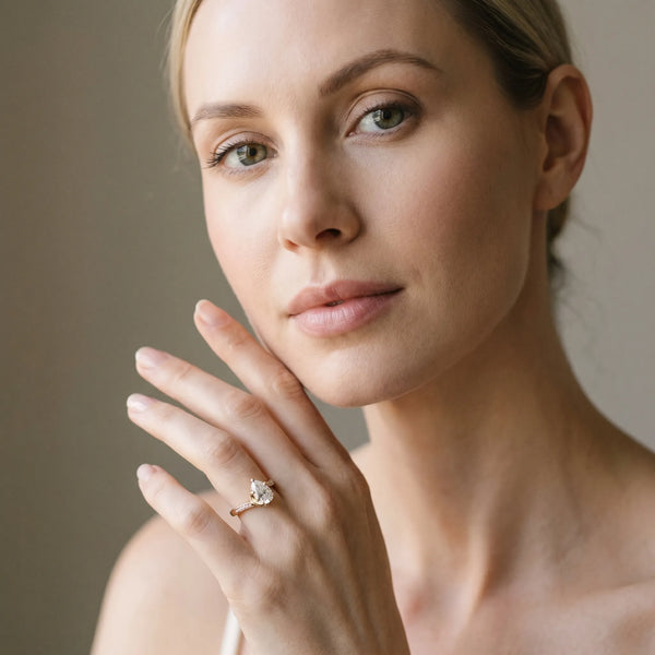 Yellow gold Pear Solitaire Twist Band with Channel-Set Diamonds and Four-Prong Setting