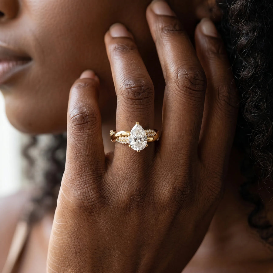 Yellow gold Pear Solitaire Twist Band with Pave Prong Setting