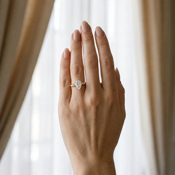 Yellow gold Pear Solitaire Twisted Band Prong Set Engagement Ring