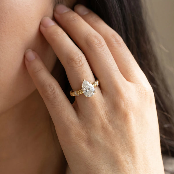 Yellow gold Pear Solitaire Twisted Band Prong Set Engagement Ring