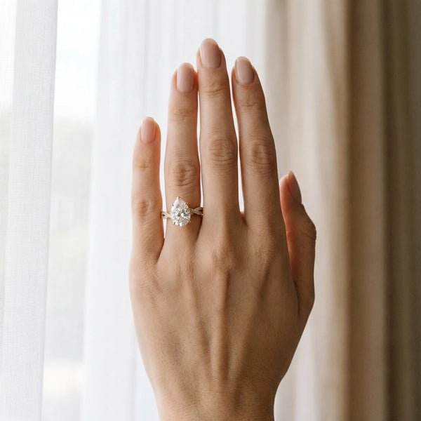 Yellow gold Pear Solitaire Twisted Pave Band with Four-Prong Setting