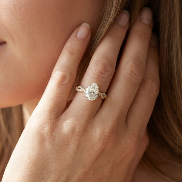 Yellow gold Pear Solitaire Twisted Pave Band with Four-Prong Setting