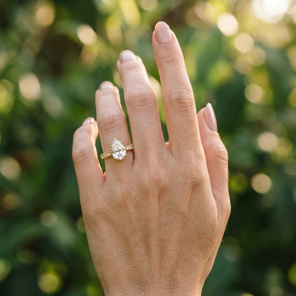 Yellow gold Pear Solitaire with Pavé Band and Four-Prong Setting