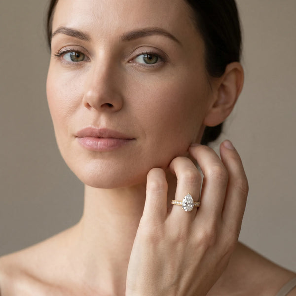 Yellow gold Pear Solitaire with Pavé Band and Four-Prong Setting