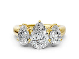 Yellow gold Pear Three-Stone Diamond Ring with Prong Setting on a Classic Band_15