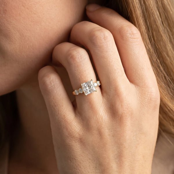 Yellow gold Princess Brilliant Diamond Five-Stone Engagement Ring with Prong Setting on a Classic Band