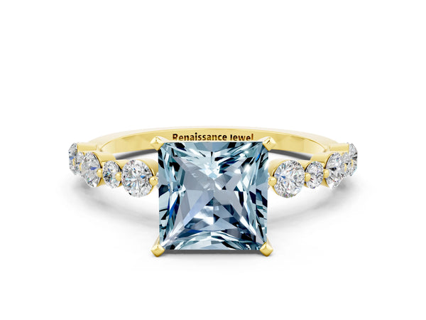 Yellow gold Princess Cut Aquamarine Prong Set Engagement Ring with Pavé Band