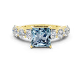 Yellow gold Princess Cut Aquamarine Prong Setting with Side Stones on a Pave Band
