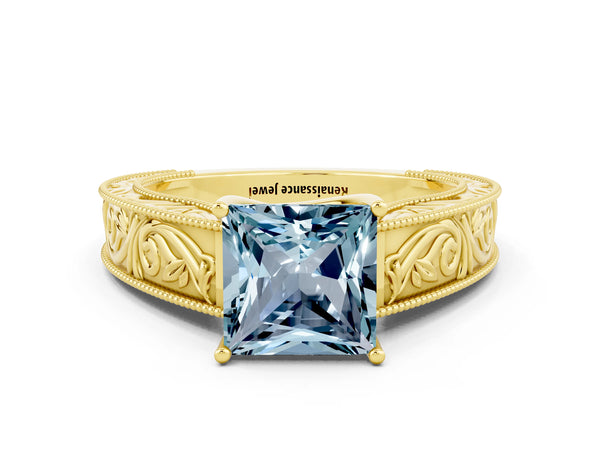 Yellow gold Princess Cut Aquamarine Solitaire Ring with Engraved Band and Four-Prong Setting