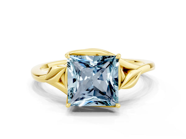Yellow gold Princess Cut Aquamarine Solitaire Ring with Twist Band and Four-Prong Setting
