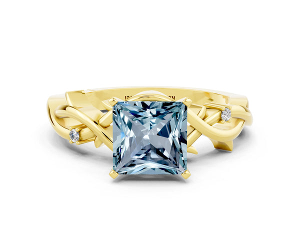 Yellow gold Princess Cut Aquamarine Solitaire Ring with Twisted Band and Prong Setting