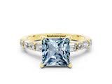 Yellow gold Princess Cut Aquamarine Solitaire with Side Baguettes and Channel Set Band