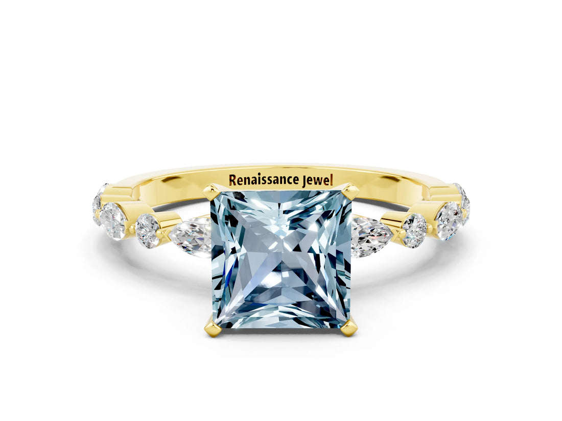 Yellow gold Princess Cut Aquamarine Solitaire with Side Stones on a Pavé Band and Four-Prong Setting