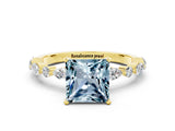 Yellow gold Princess Cut Aquamarine Solitaire with Side Stones on a Pavé Band and Four-Prong Setting