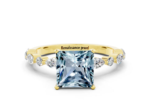 Yellow gold Princess Cut Aquamarine Solitaire with Side Stones on a Pavé Band and Four-Prong Setting