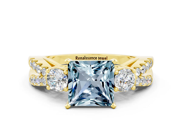 Yellow gold Princess Cut Aquamarine Three-Stone Ring with Pavé Split Shank and Four-Prong Setting