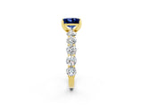 Yellow gold Princess Cut Blue Sapphire Prong Setting with Side Stones on a Pave Band_2