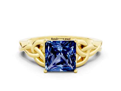 Yellow gold Princess Cut Blue Sapphire Solitaire Engagement Ring with Celtic Knot Band and Four-Prong Setting