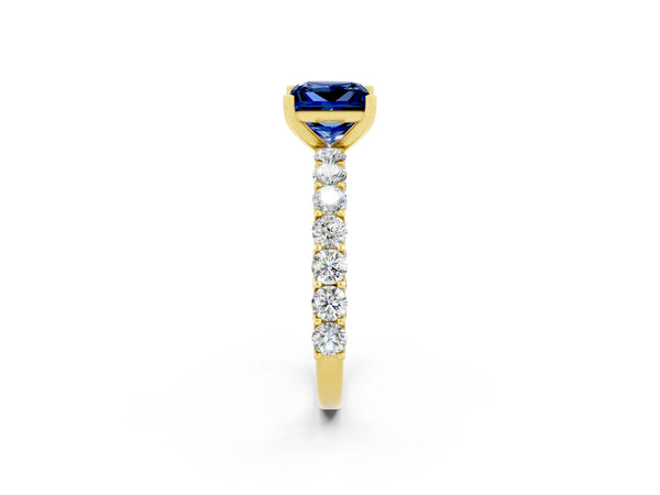 Yellow gold Princess Cut Blue Sapphire Solitaire Ring with Shared Prong Pavé Band and Four-Prong Setting